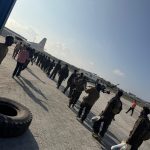 Haramcad police units boarding a Fokker 50 aircraft at Aden Adde Airport for deployment to Barawe