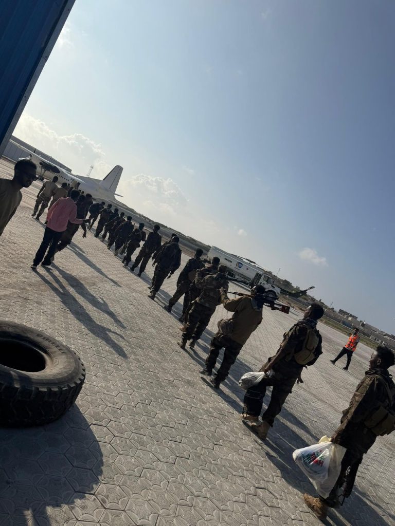 Haramcad police units boarding a Fokker 50 aircraft at Aden Adde Airport for deployment to Barawe